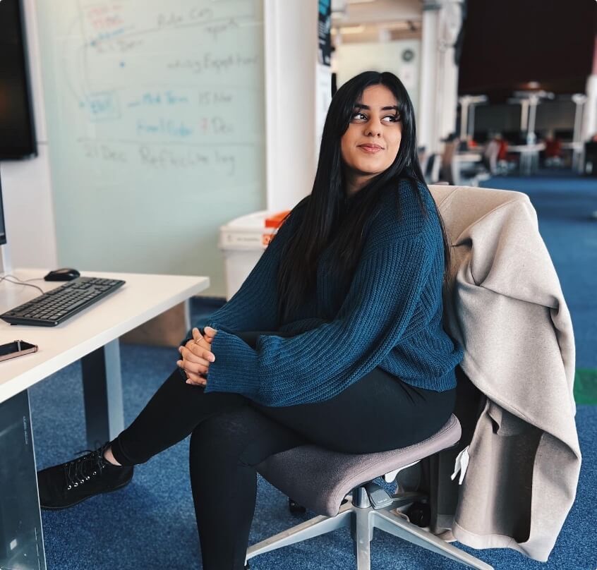 Girl sat in a chair at a desk